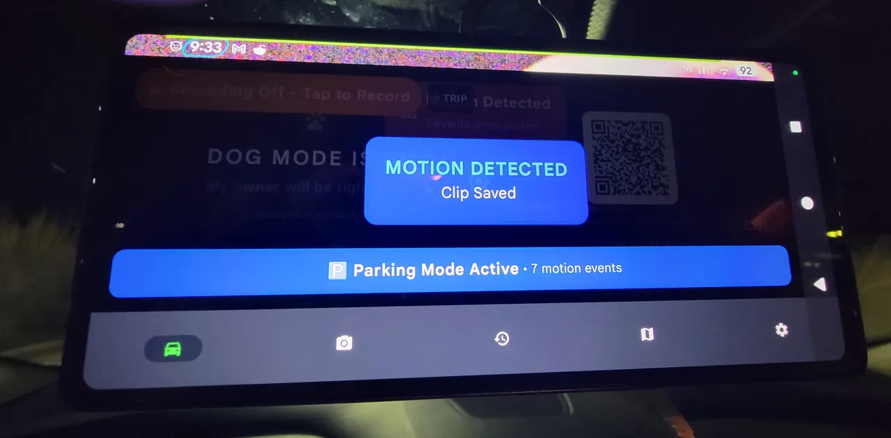 DriveSight showing MOTION DETECTED — Clip Saved toast with Parking Mode Active and 7 motion events