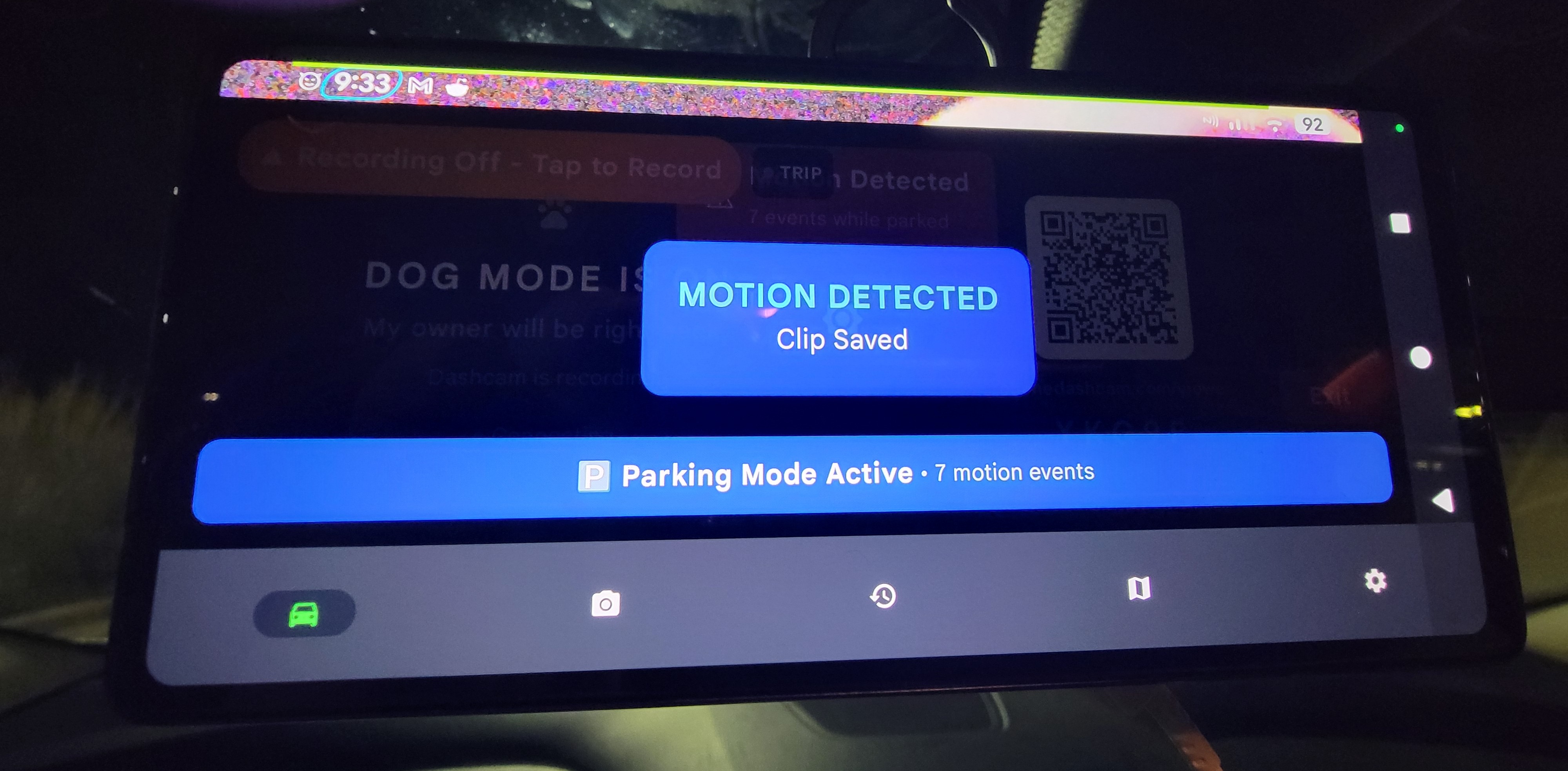 Phone Dashcam showing MOTION DETECTED — Clip Saved toast with Parking Mode Active and 7 motion events