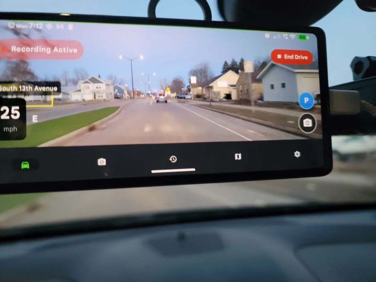 Phone Dashcam app running on phone mounted on car windshield showing dashcam recording at 25 mph