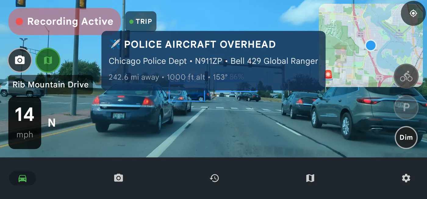 DriveSight drive screen showing a police aircraft overhead alert with the operator, tail number, aircraft type, distance and altitude