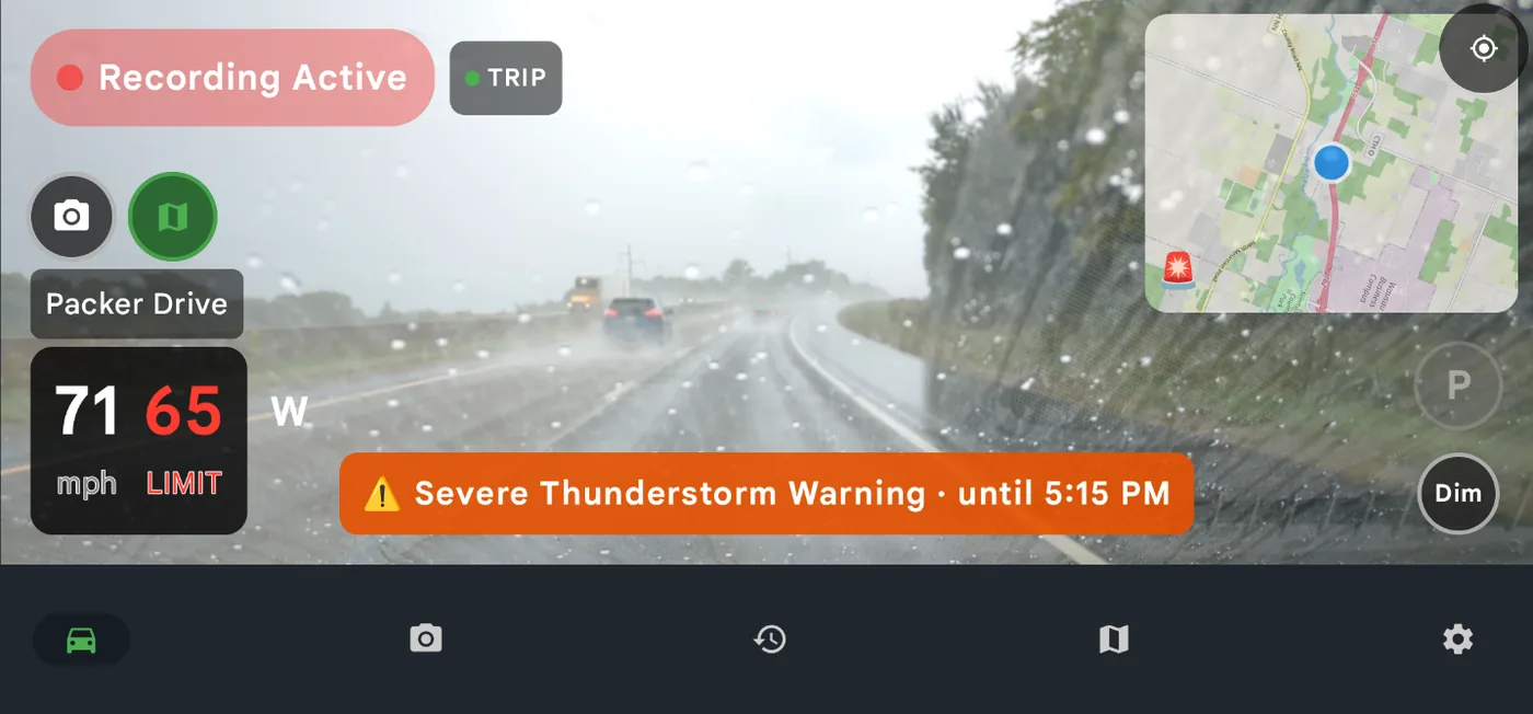 DriveSight drive screen in heavy rain showing a Severe Thunderstorm Warning banner with its expiry time